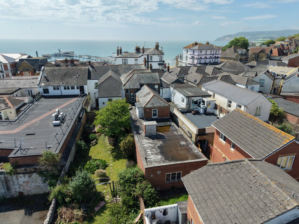 Lot: 75 - FREEHOLD TOWN CENTRE BUILDING WITH POTENTIAL - Drone photo from the rear looking towards the front